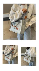 Dettaglio della borsa tote grande in tela con manici in pelle e tasche per il pendolarismo quotidiano