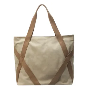 Large beige vintage canvas tote bag with thick brown reinforced straps for daily commute