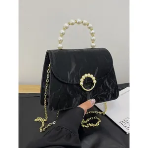 Elegant black pleated shoulder bag with pearl handle and golden chain strap for women