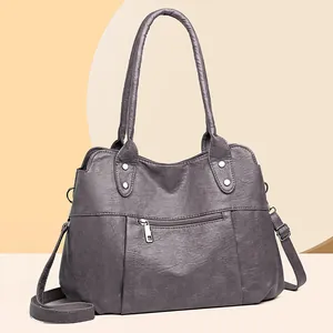 Sac fourre-tout vintage en cuir gris foncé avec fermetures éclair et bandoulières
