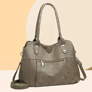 Grand sac cabas rétro kaki en similicuir avec bandoulière tissée et clous argentés