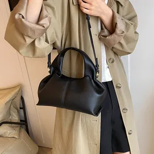 Retro black litchi texture handbag with smooth curves and adjustable strap for women