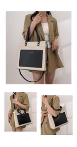 Detailed views of the beige canvas tote bag with black leather pockets and dual handles