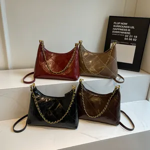 Detailed display of vintage quilted underarm bags in burgundy, taupe, black, and tan leather