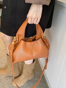 Minimalist brown leather hobo bag with lychee texture and pleated design for women