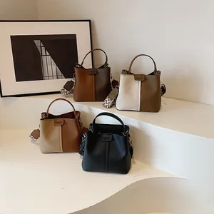 Detailed display of four color options for the leather bucket bag with stylish wide straps