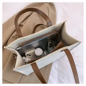 Top-down view of a spacious canvas tote bag showing interior compartments and large capacity