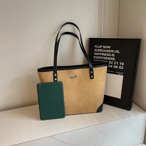 Brown suede tote bag shown with an iPad to demonstrate large internal storage capacity