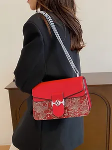 Retro red crossbody bag with silver chain and ethnic floral embroidery detail