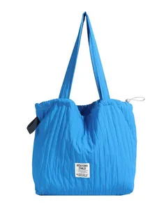 Blue quilted nylon striped tote bag for women with shoulder straps and brand label