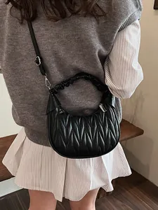 Retro black quilted cloud bag with pleated handle and adjustable leather crossbody strap