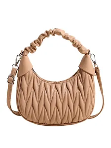 Vintage beige pleated dumpling bag with crescent shape and detachable shoulder strap