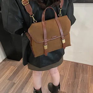 Detailed back view of a vintage brown frosted leather backpack with dual straps and buckles