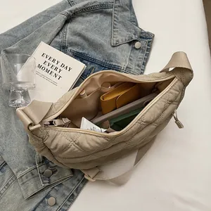 Interior view showing the large capacity and storage of the quilted crossbody bag