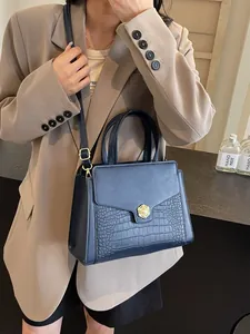 Navy blue faux crocodile leather tote bag with pearl buckle and crossbody strap