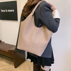 Chic beige woven tote bag for women shown with professional casual office attire