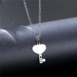 Polished stainless steel heart key necklace with LOVE engraving on a minimalist chain
