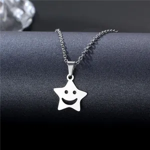Polished stainless steel necklace featuring a smiling face cutout in a star pendant