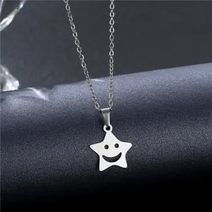 Minimalist silver stainless steel star pendant necklace with hollow smiley face on star