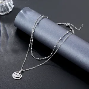 Double-layer silver titanium steel necklace with LOVE heart pendant on a display