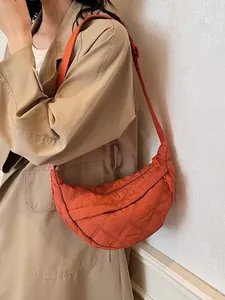 Quilted half-moon shoulder bag in orange nylon with adjustable strap for women