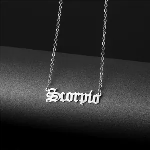 Detailed shot of silver Scorpio zodiac necklace pendant in gothic font on dark background