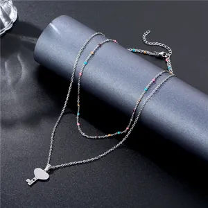 Double-layered silver necklace with colorful beads and a heart-shaped LOVE key pendant