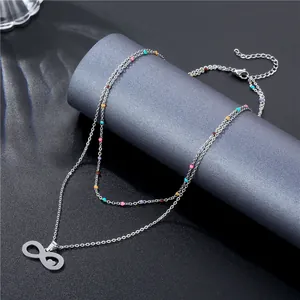 Bohemian silver double layer infinity necklace with colored beads on a luxury dark background