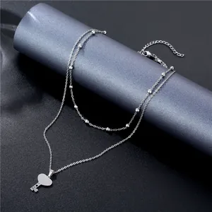 Double-layered silver stainless steel necklace with heart key pendant and LOVE engraving