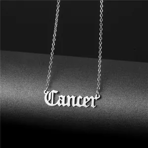 Silver gothic Cancer zodiac pendant necklace with a fine chain on a dark pedestal