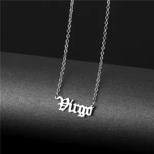 Macro shot of silver Virgo zodiac pendant in gothic font on a fine link chain
