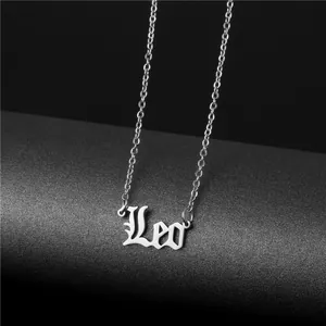 Macro shot of polished silver Leo zodiac pendant necklace with elegant script font detail