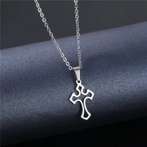 Macro shot of silver cutout cross pendant with high-shine finish on O-link chain