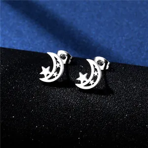 Macro shot of silver hollow moon and star studs with butterfly back on black stand