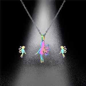Close-up of rainbow gradient angel necklace and stud earrings set on a glitter background