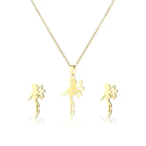 Golden stainless steel fairy pendant necklace and matching stud earrings set on white background