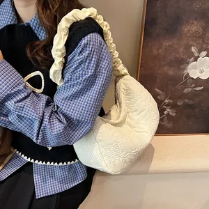 Chic quilted hobo bag in cream with a stylish ruched shoulder strap detail