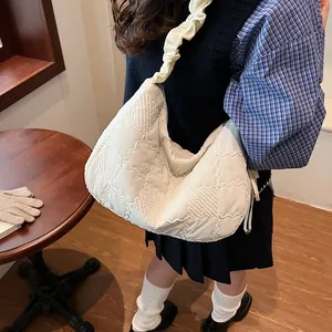 Quilted cream tote bag with ruffled strap and vintage plaid texture for women