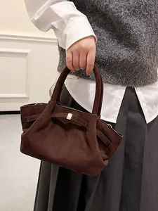 Retro dark brown suede tote bag with decorative strap and vintage matte texture