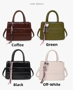Detail view of tote bags in brown, green, black, and off-white with embossed letters