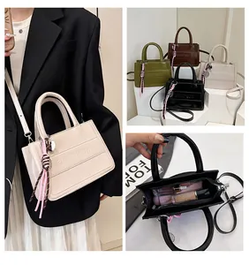 Internal view of leopard print tote bag showing large capacity for cosmetics and phone