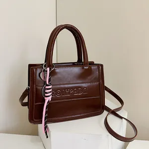 Retro PU Leather Tote Bag For Women Large Capacity Shoulder Crossbody Bag With Letter Embossing And Fashion Pendant