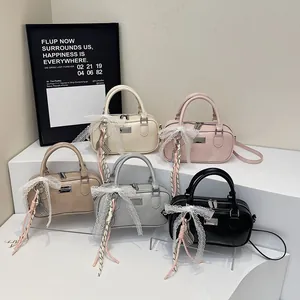 Group shot of vintage bowling handbags in five colors with lace bow charms and straps