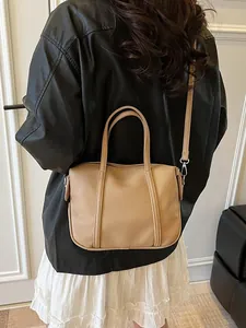 Chic beige lychee pattern leather handbag with adjustable strap for women in daily casual use