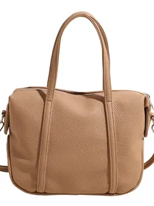 Fashionable tan lychee grain leather tote bag with dual handles and metal zipper closure