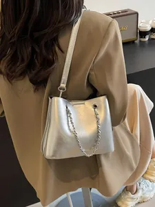 Silver metallic chain bucket bag for women with polished finish and sleek crossbody strap