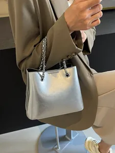 Minimalist silver metallic tote bag with chain strap for women, stylish commuter shoulder bag