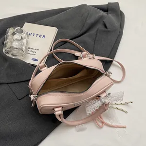 Detailed interior of pink Boston bag showing spacious compartment and PU leather texture