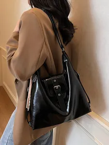 Fashionable black patent leather tote bag with silk scarf decoration for women