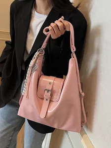 Chic pink glossy large capacity hobo bag with striped strap on casual outfit